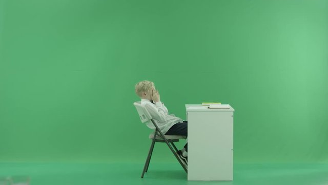 a student wants to sleep on the lesson on the green screen