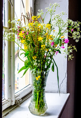 flowers at an old window