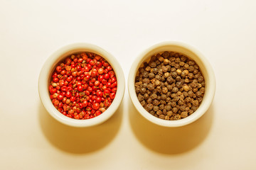 Spices in a bowls isolated on white background, top view