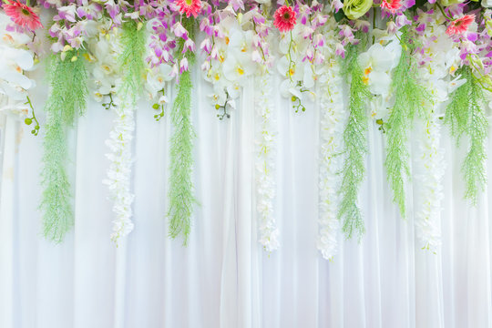 Beautiful flowers curtain backdrop background in wedding scene ceremony.