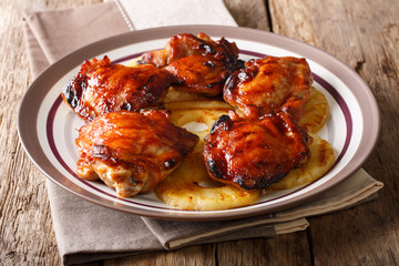 Huli-huli chicken is a grilled chicken dish in Hawaiian cuisine, prepared by barbecuing closeup. Horizontal