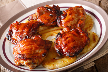 Traditional Hawaiian grilled huli huli chicken with pineapple closeup. horizontal