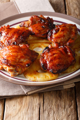 Hawaiian barbecue: chicken huli huli with pineapple close-up. vertical