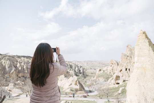 Female Tourist Taking Picture in Cappadocia, Turkey