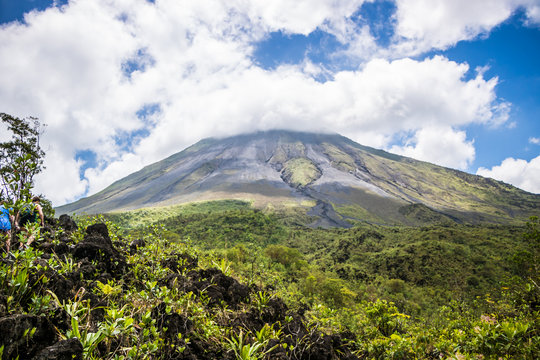 Arenal Volcano in Costa Rica with its peak shrouded in light clouds