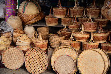 made baskets shop.There are many kind of basket that are made of bamboo.Basket wicker is Thai handmade.it is woven bamboo texture for background. Traditional Thai woven straw texture.