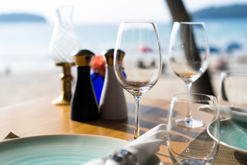 Table set for dining at restaurant at beach