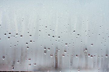 Water droplets condensation background of dew on glass window, humidity and foggy blank background....