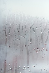 Water droplets condensation background of dew on glass window, humidity and foggy blank background....