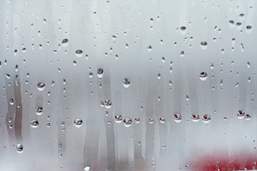 Water droplets condensation background of dew on glass window, humidity and foggy blank background....