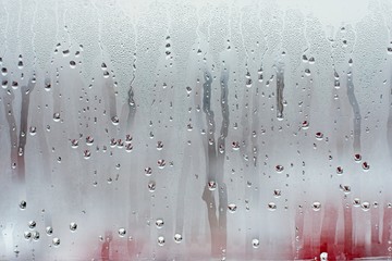 Water droplets condensation background of dew on glass window, humidity and foggy blank background....