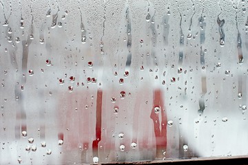 Water droplets condensation background of dew on glass window, humidity and foggy blank background....