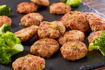 baked meat patties with broccoli and cheese
