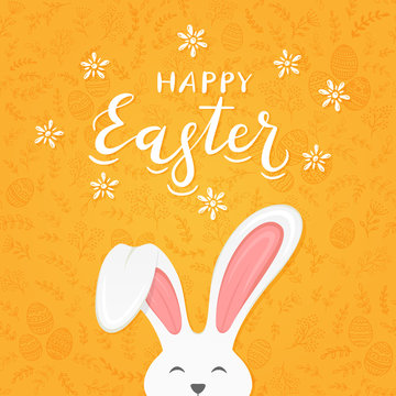 Orange background with pattern and text Happy Easter with rabbit ears
