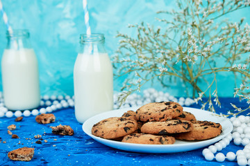 Cookie chocolate with a milk bottles.