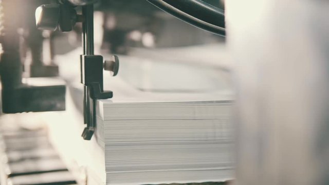 Printed sheets of paper are served in the printing process