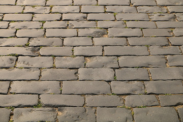 The texture of the stones and cobblestones. A fragment of a trawler in the old town.