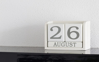 White block calendar present date 26 and month August