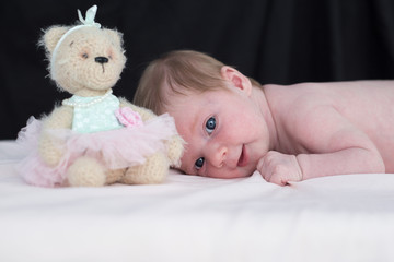 newborn baby with bear cub © Prokhorova