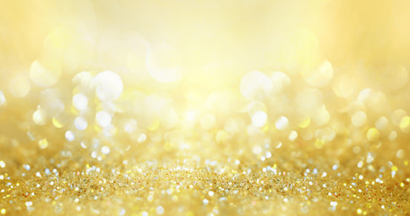 Glitter background golden saturated color ,de-focused, macro. Sparks fall and sparkle, free space.