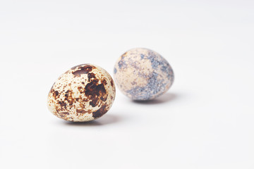 two quail eggs isolated on white background