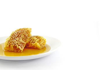 Fresh honey with honeycomb with blank white space on the right