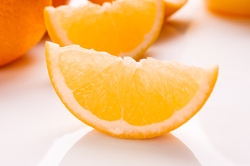 oranges and juice on a white background