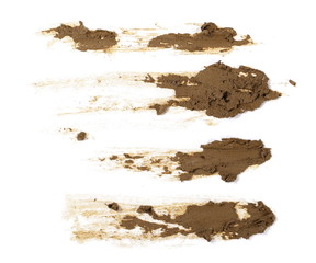 Smeared mud, stains isolated on white background, top view