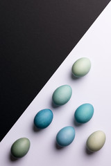 Happy Easter black and white background. Hand painted blue Easter eggs abstract minimal concept.