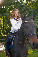 Obraz premium girl teenager with a horse