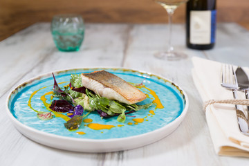 Roasted char on truffled avocado salad, wild herbs and carrot oil