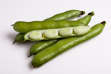 fresh broad beans on a white background