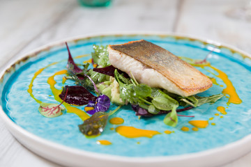 Roasted char on truffled avocado salad, wild herbs and carrot oil
