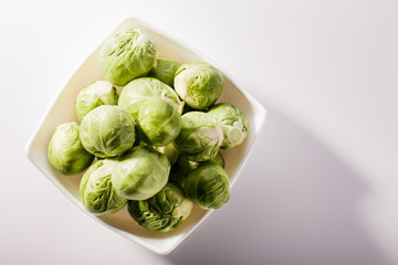 Brussels sprouts on a rustic wooden background