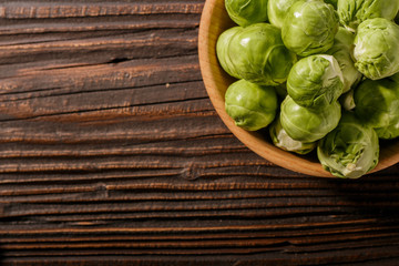 Brussels sprouts on a rustic wooden background