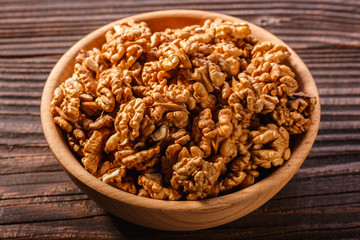 Walnut on a dark rustic wooden background