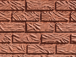 Obraz premium Original background from a figured red brick