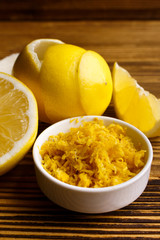 Lemon and juice on a wooden background