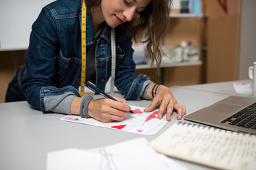 Fashion designer making sketch in the workshop