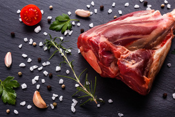 fresh lamb meat on a textured stone plate