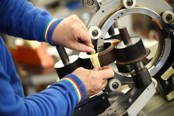 Obraz premium Man working on electric transformer in close up