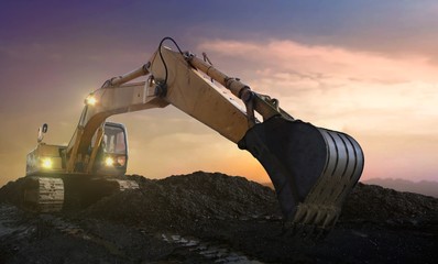 excavator on site at sunset © razihusin