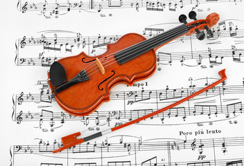 Fototapeta na wymiar Toy violin and music sheet