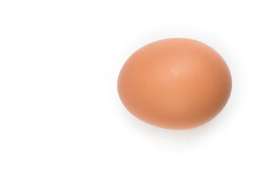 Single brown chicken egg isolated on white. Top view