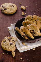 Chocolate chip cookies in a bowl on wooden table
