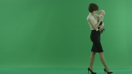 A Business woman going from the left side with her baby on the green screen