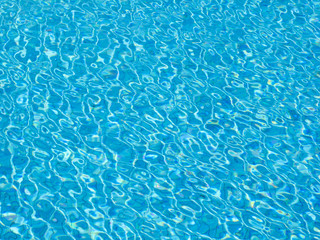 Fototapeta na wymiar Blue shiny swimmingpool reflection