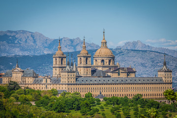 The Royal Seat of San Lorenzo de El Escorial, historical residence of the King of Spain, about 45 kilometres northwest Madrid, in Spain. - obrazy, fototapety, plakaty