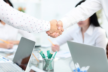 Business partnership meeting concept. Image businessmans handshake. Successful businessmen handshaking after good deal. Horizontal, blurred background