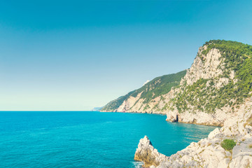Fototapeta premium Beautiful seascape. Calm blue sea and rocks